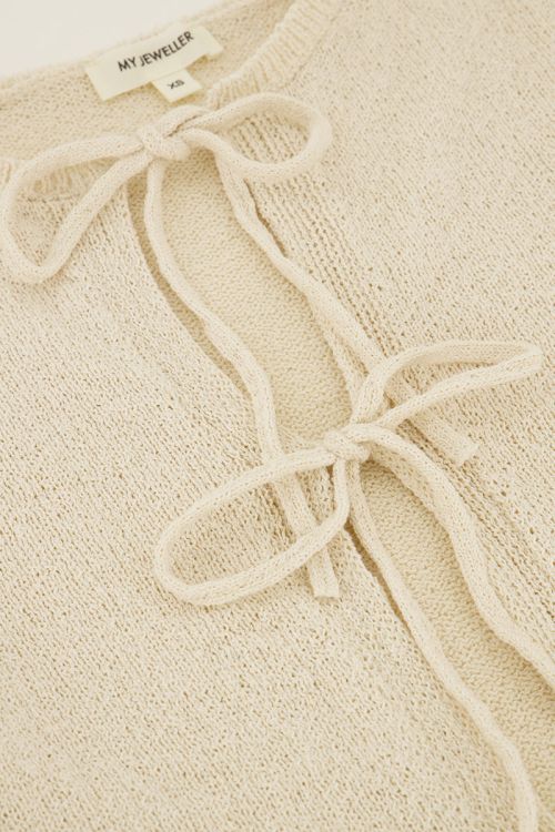 Beige vestje met strikjes