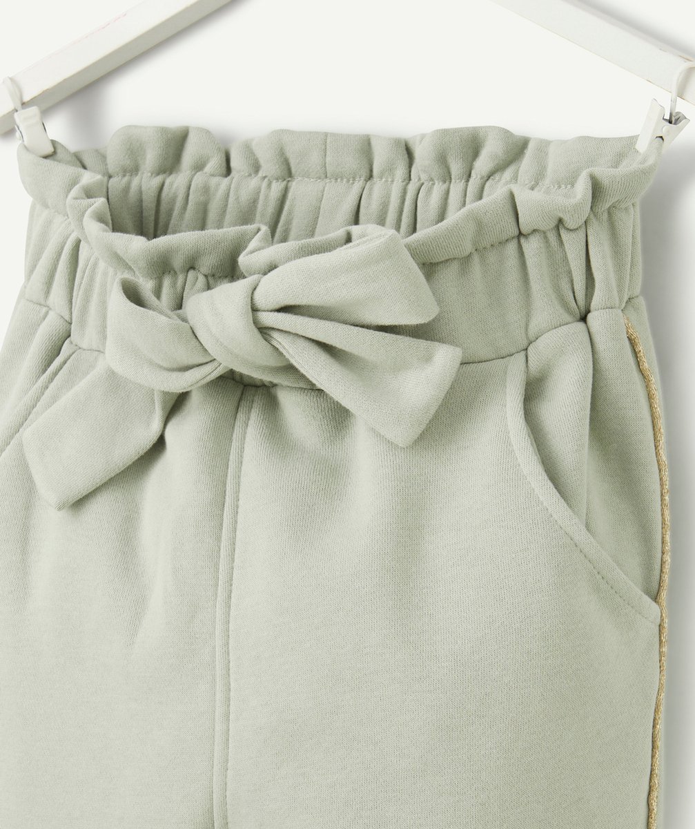 JOGGING FILLE EN FIBRES RECYCLÉES VERT AVEC NOEUD ET LISERÉS PAILLETÉS