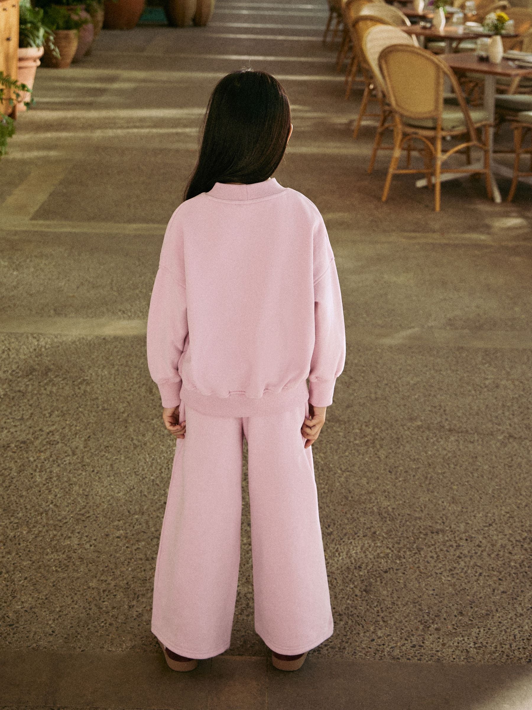 Roze met slogan - Set van sweatshirt en joggingbroek met wijde pijpen (3-16jr)