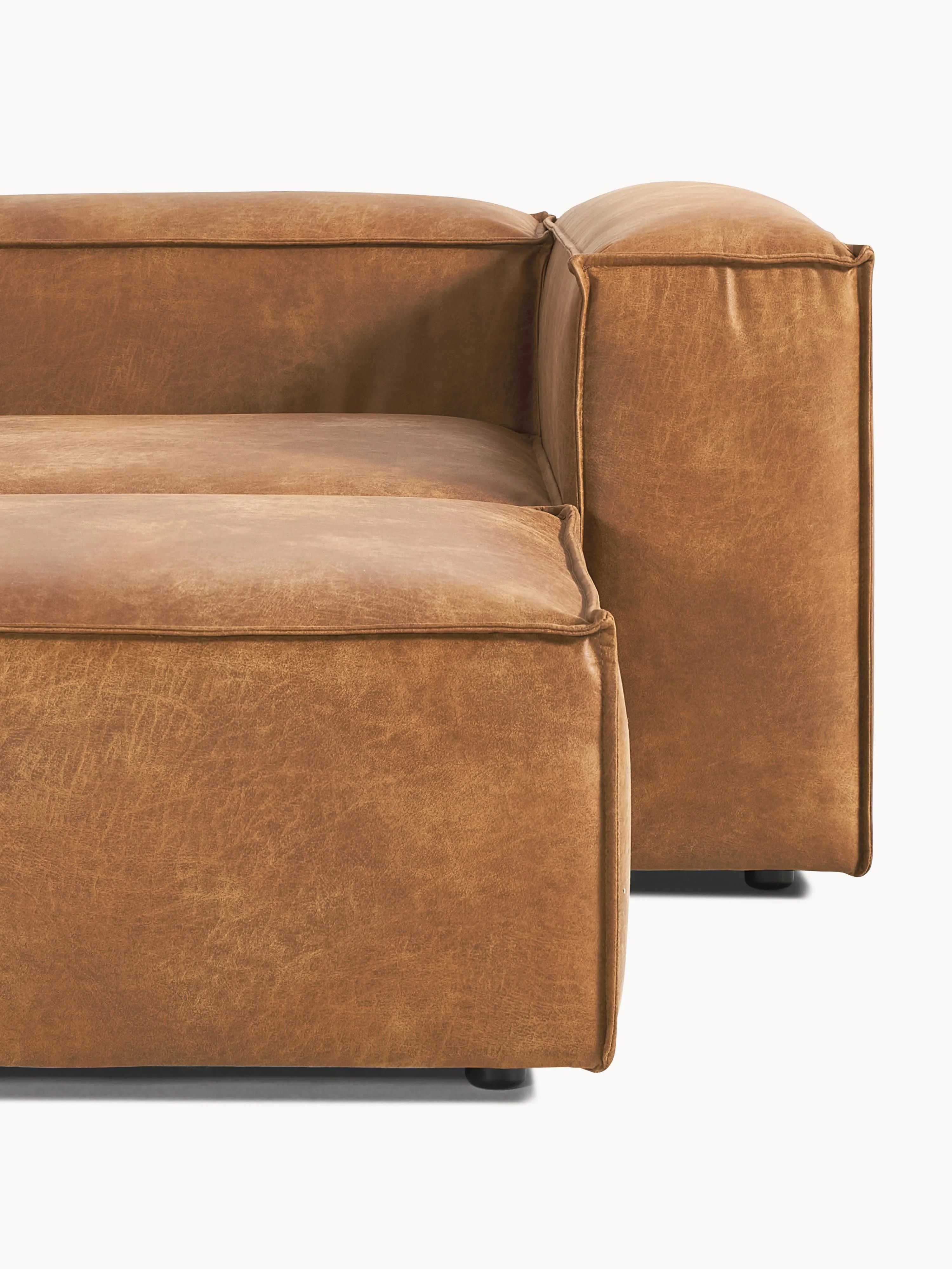 Modulaire bank Lennon (4-zits) van gerecycled leer met poef (links/rechts)