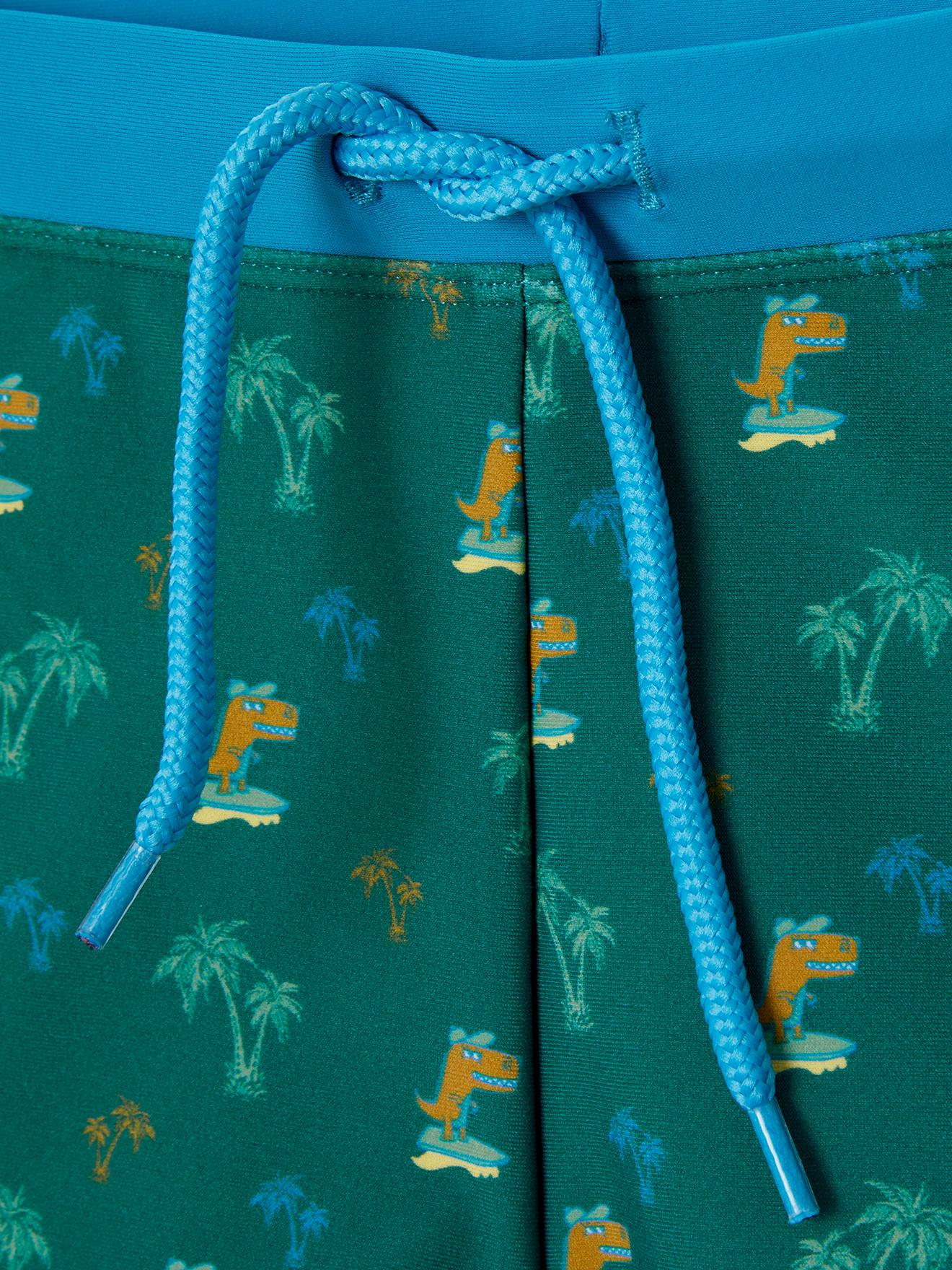 Calção de banho boxer infantil verde-escuro com estampa de ilha e dinossauro.