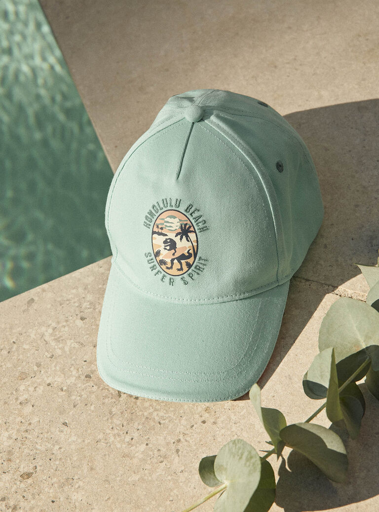 Casquette turquoise en twill à motif dinosaure
