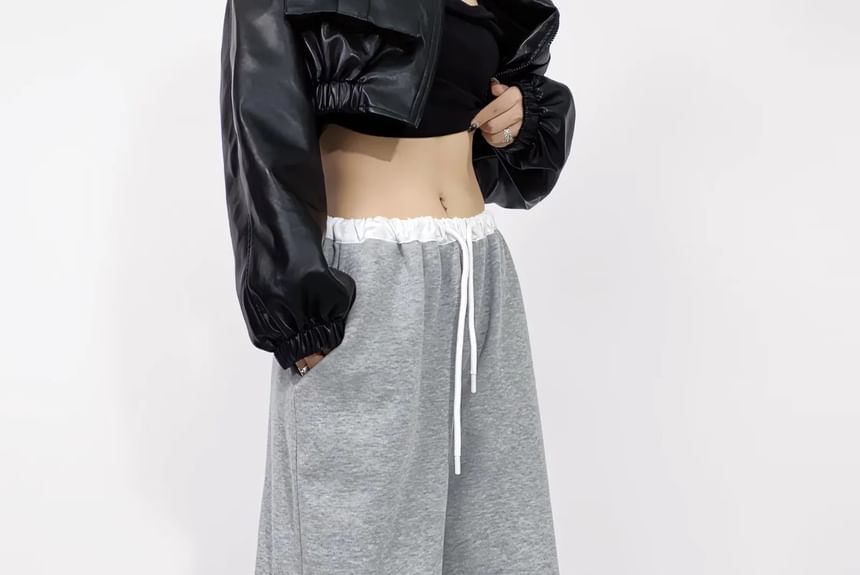 Asiris - Lage, contrasterende, losse joggingbroek met wijde pijpen