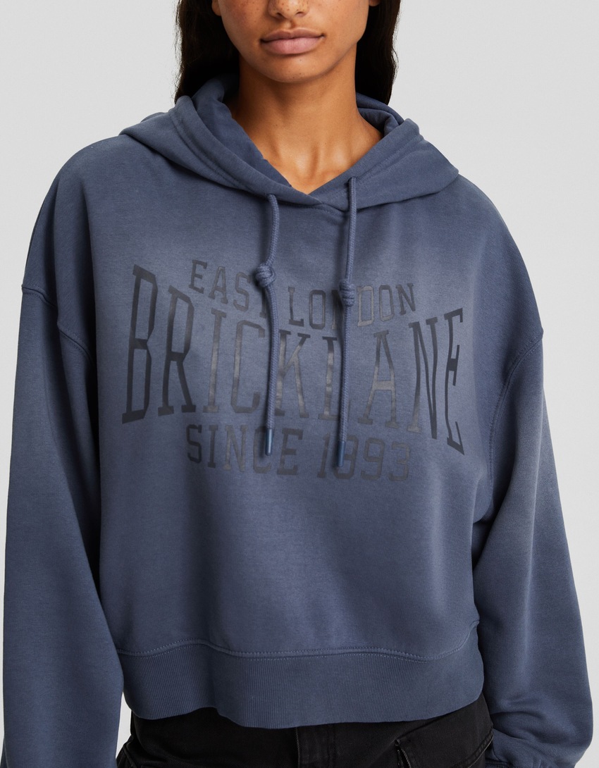 Moletom oversized com efeito desbotado e slogan