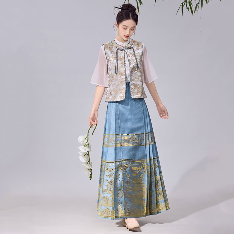 Tangier - Traditionele Chinese blouse met elleboogmouwen, opstaande kraag en doorschijnend paneel / Jacquard kikkervest met knopen / Maxi-rok met hoge taille en print