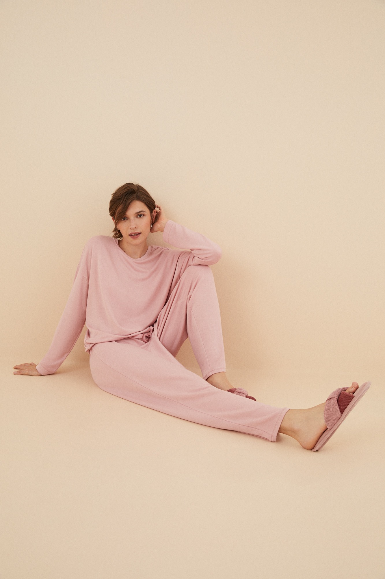 Conjunto com detalhes nas costas em rosa