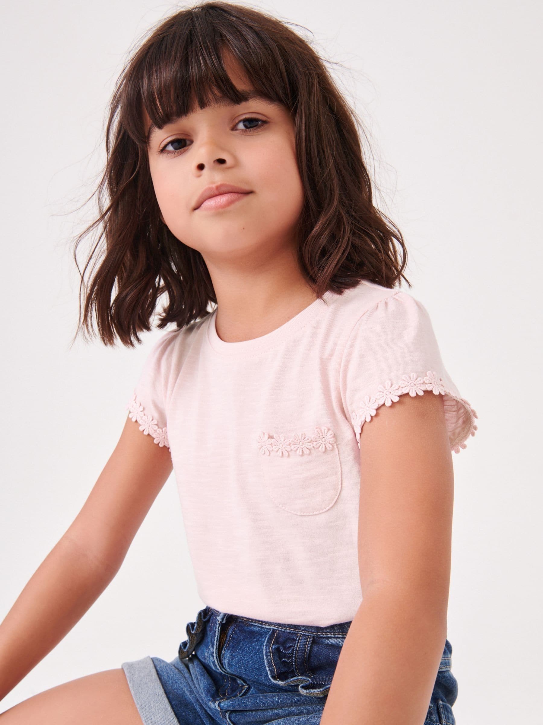 Roze - T-shirt met zakje en madeliefjesprint (1,5-16 jr)