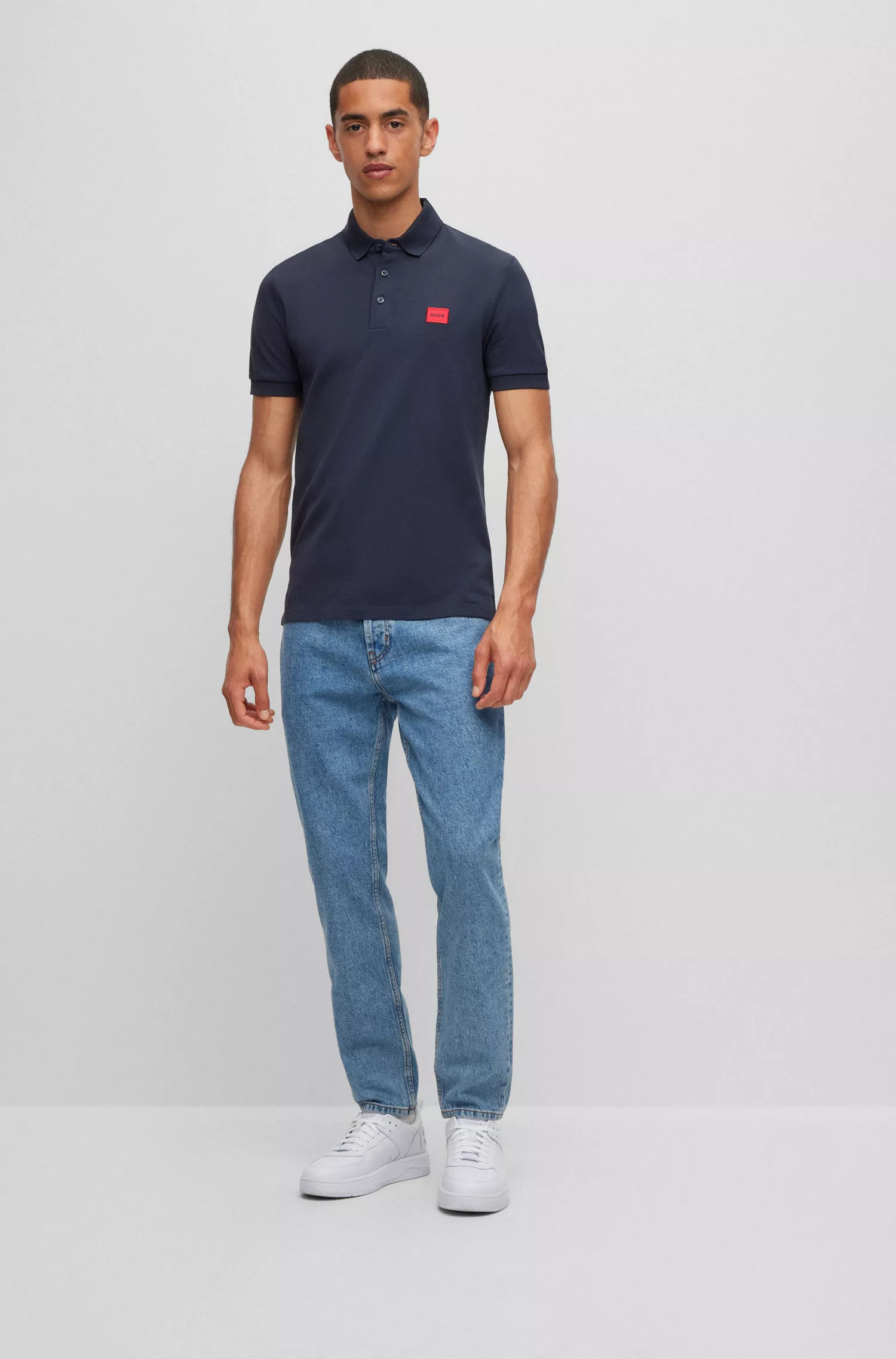 Camisa polo HUGO vermelha em piqué de algodão com corte slim e etiqueta com o logotipo.