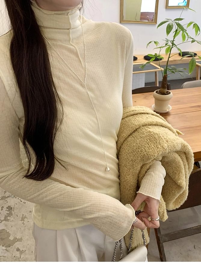 Asiris - Geribbelde top met lange mouwen en coltrui