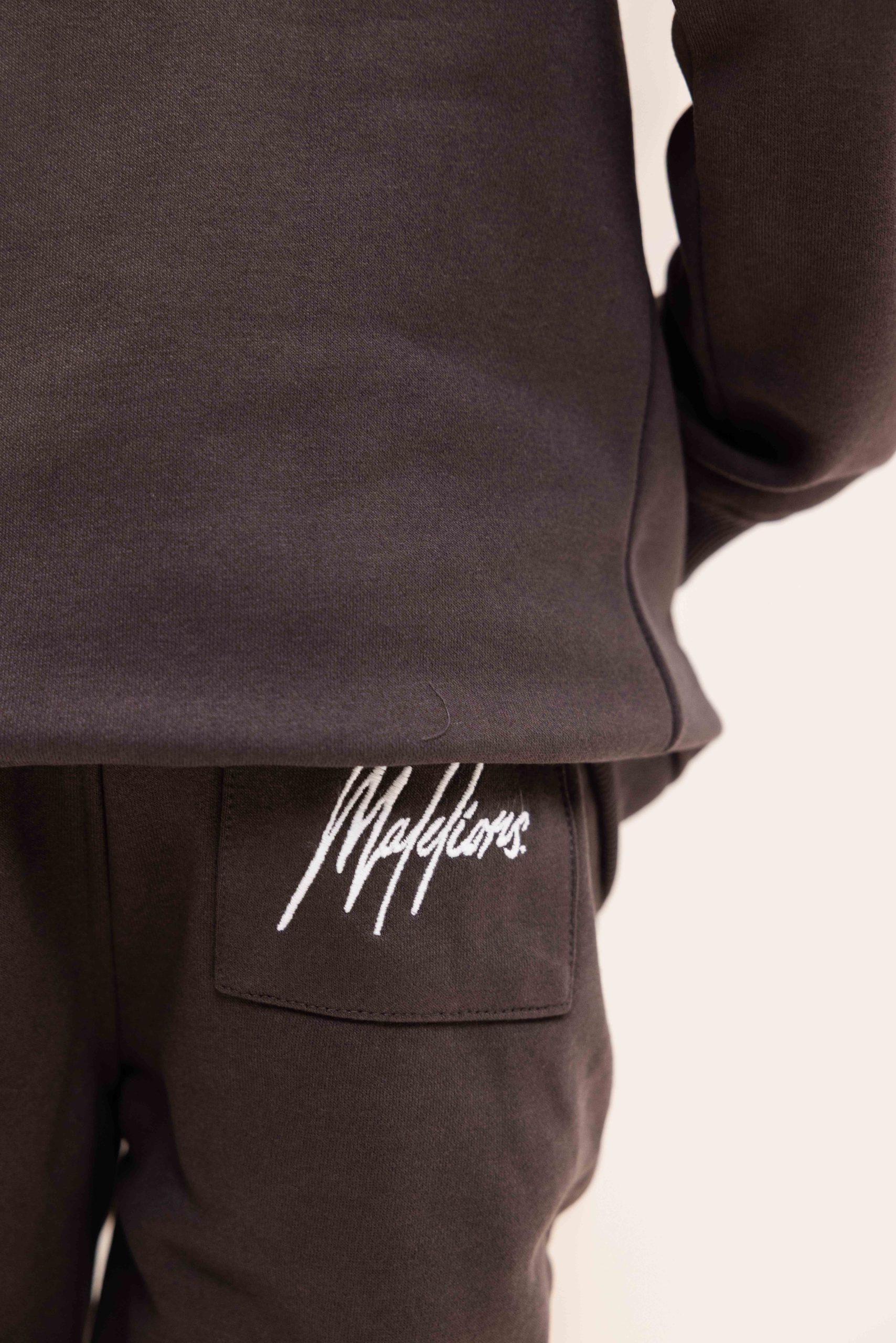 Malelions Essentials Trainingspak Kids Bruin