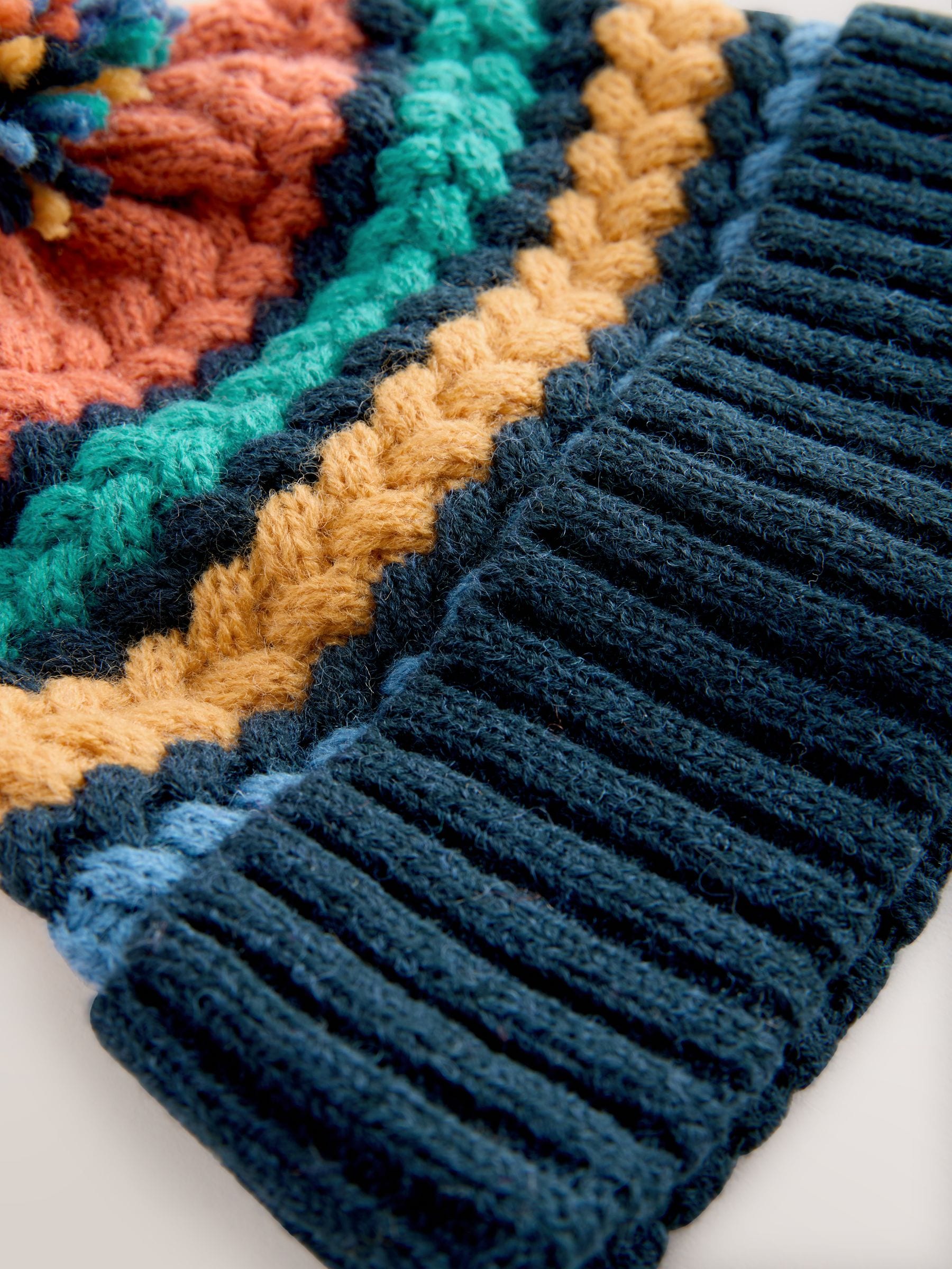 Fel kabelgebreid - Gebreide Baby muts met pompon (0mnd -2jr)