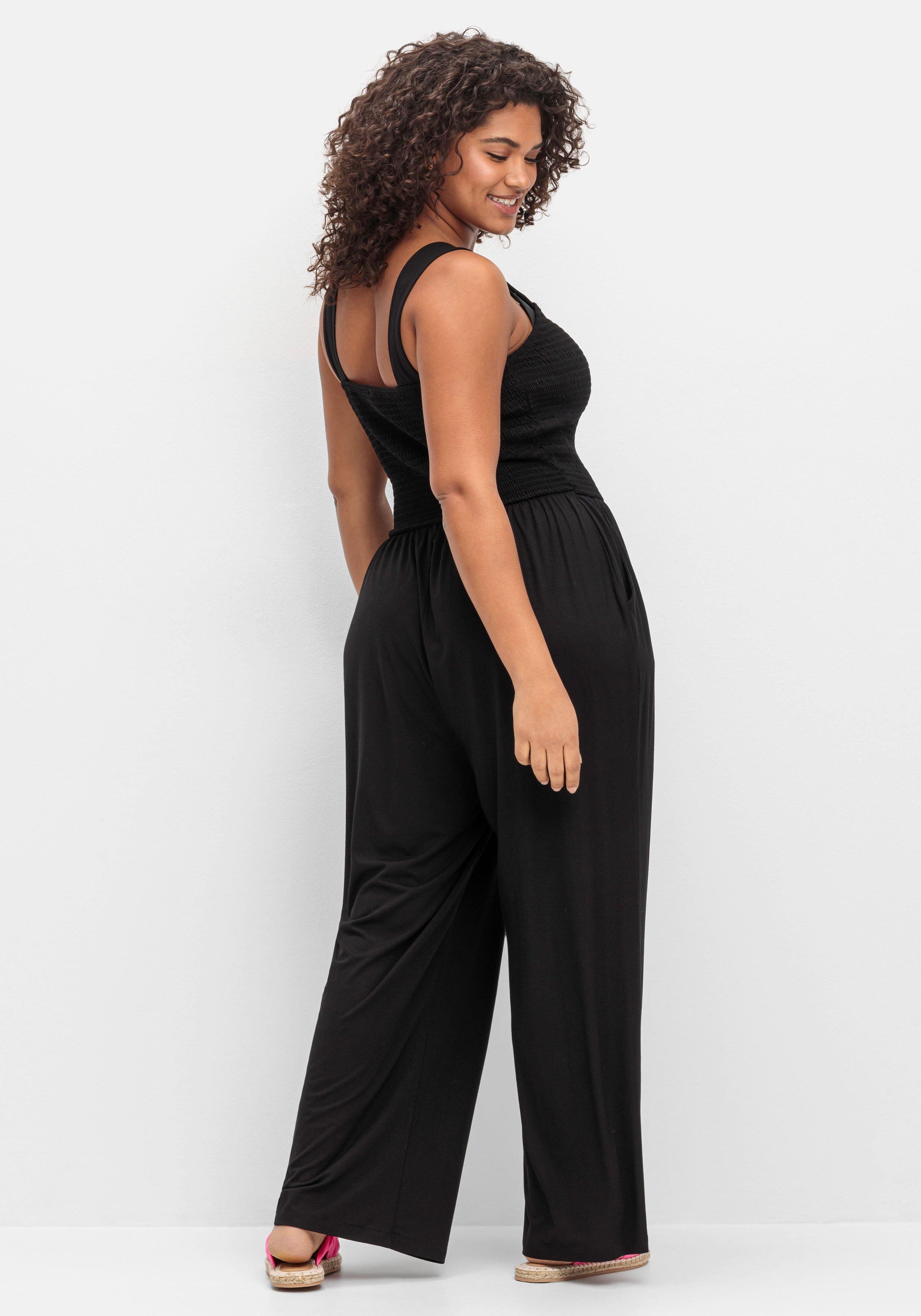 Jumpsuit mit Smok-Oberteil und weitem Bein