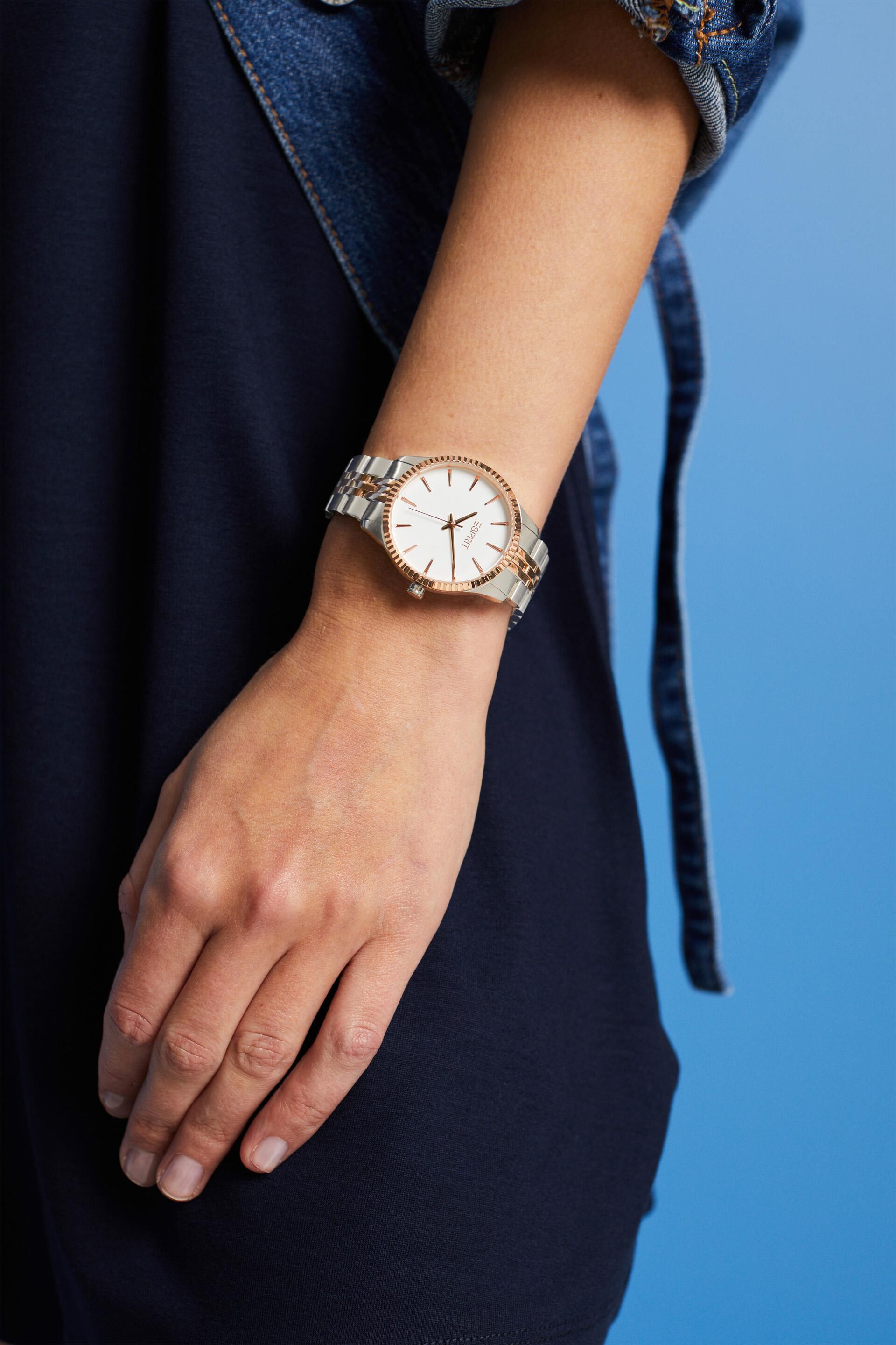 Montre bicolore à lunette ondulée