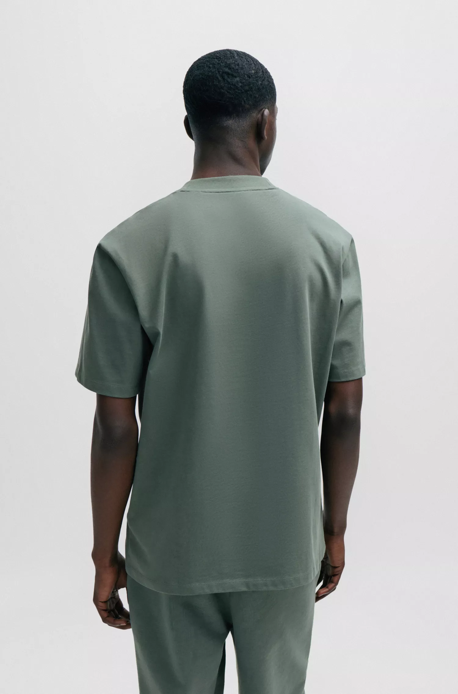 Camiseta HUGO vermelha em malha de algodão com modelagem relaxada e estampa do logo.