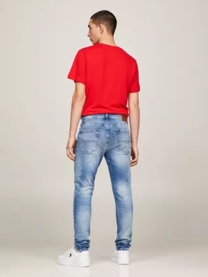 Calça jeans slim fit afunilada e desbotada