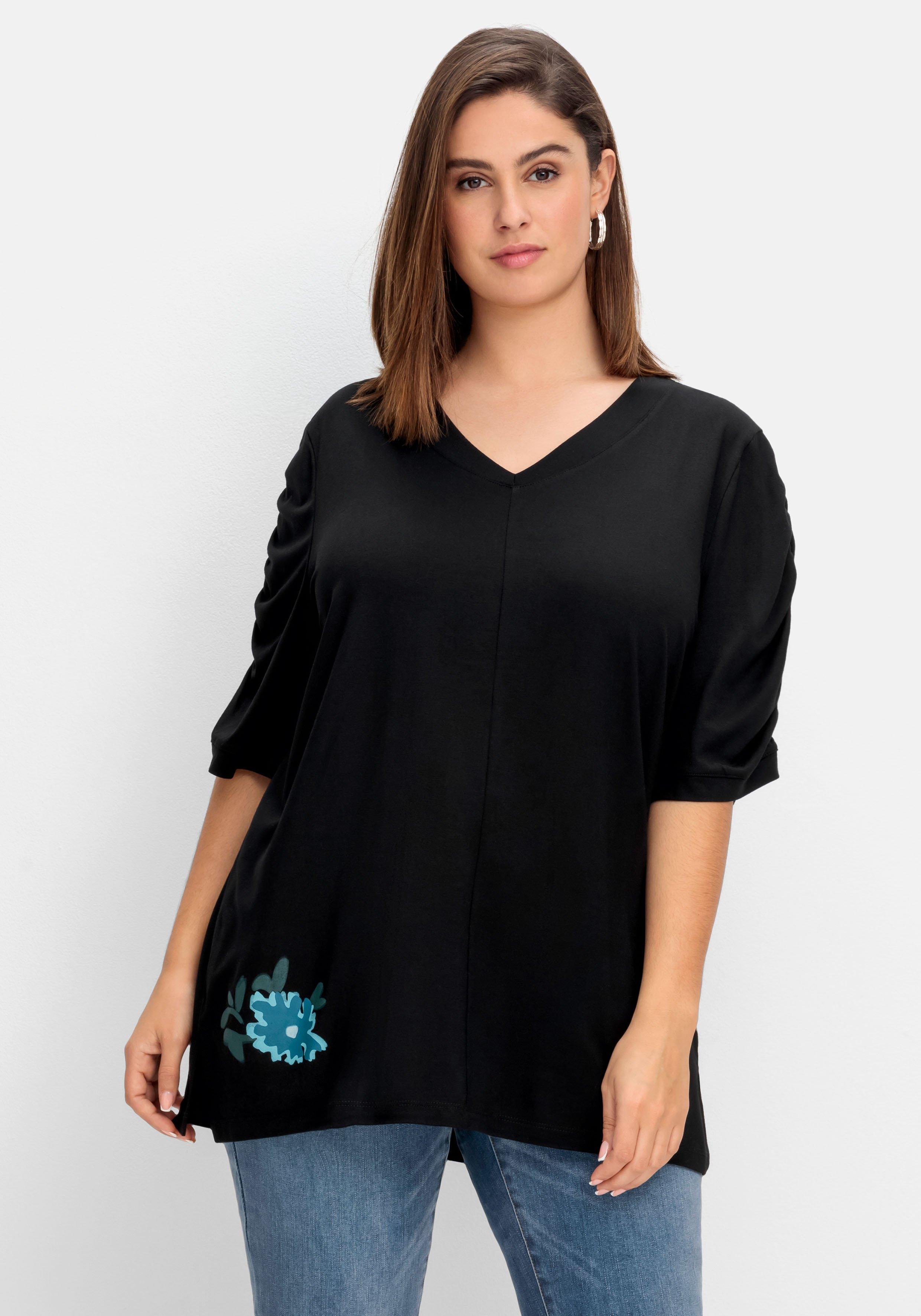 Shirt mit Blütenprint am Saum