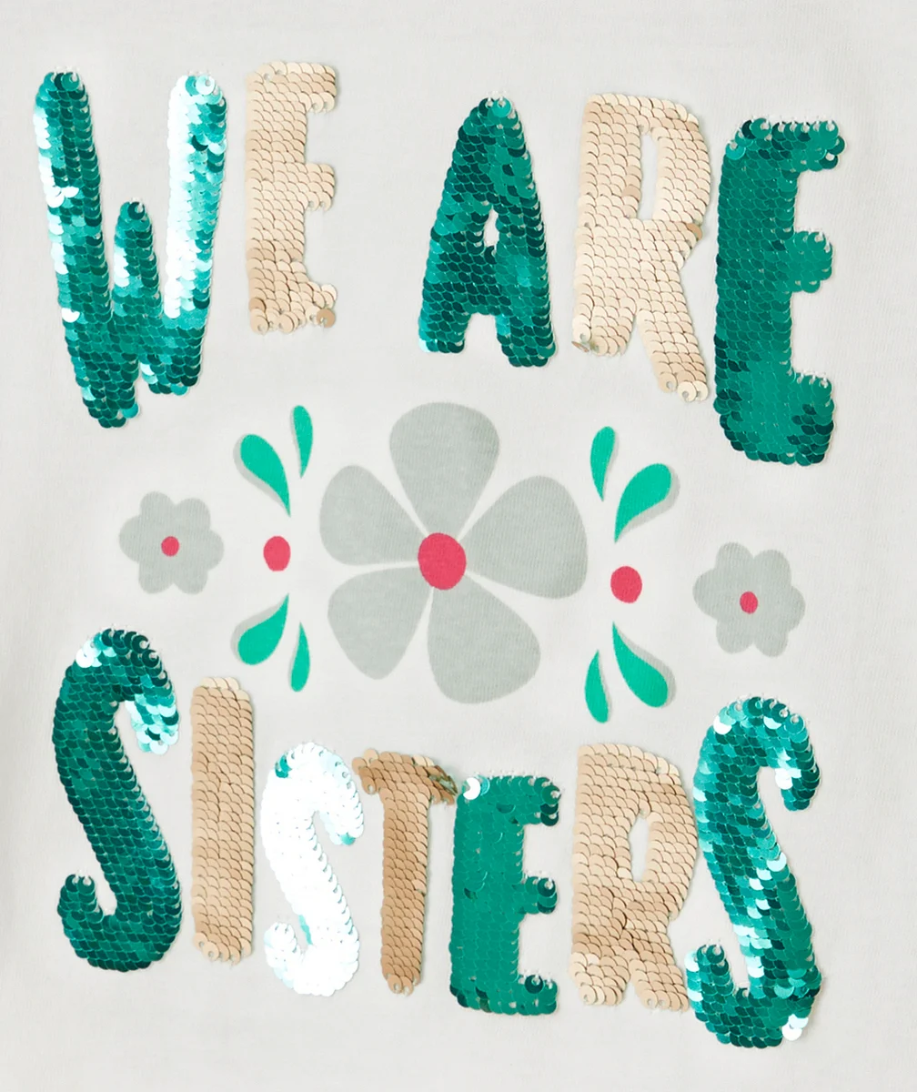 T-SHIRT FILLE EN COTON BIO BLANC AVEC MESSAGE EN SEQUINS RÉVERSIBLES