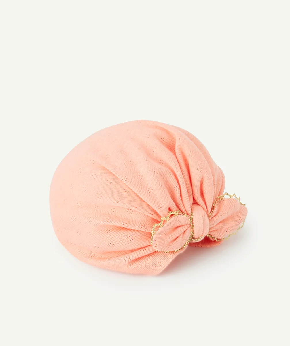 TURBAN BÉBÉ FILLE ROSE AVEC NOEUD ET DÉTAILS COULEUR DORÉE