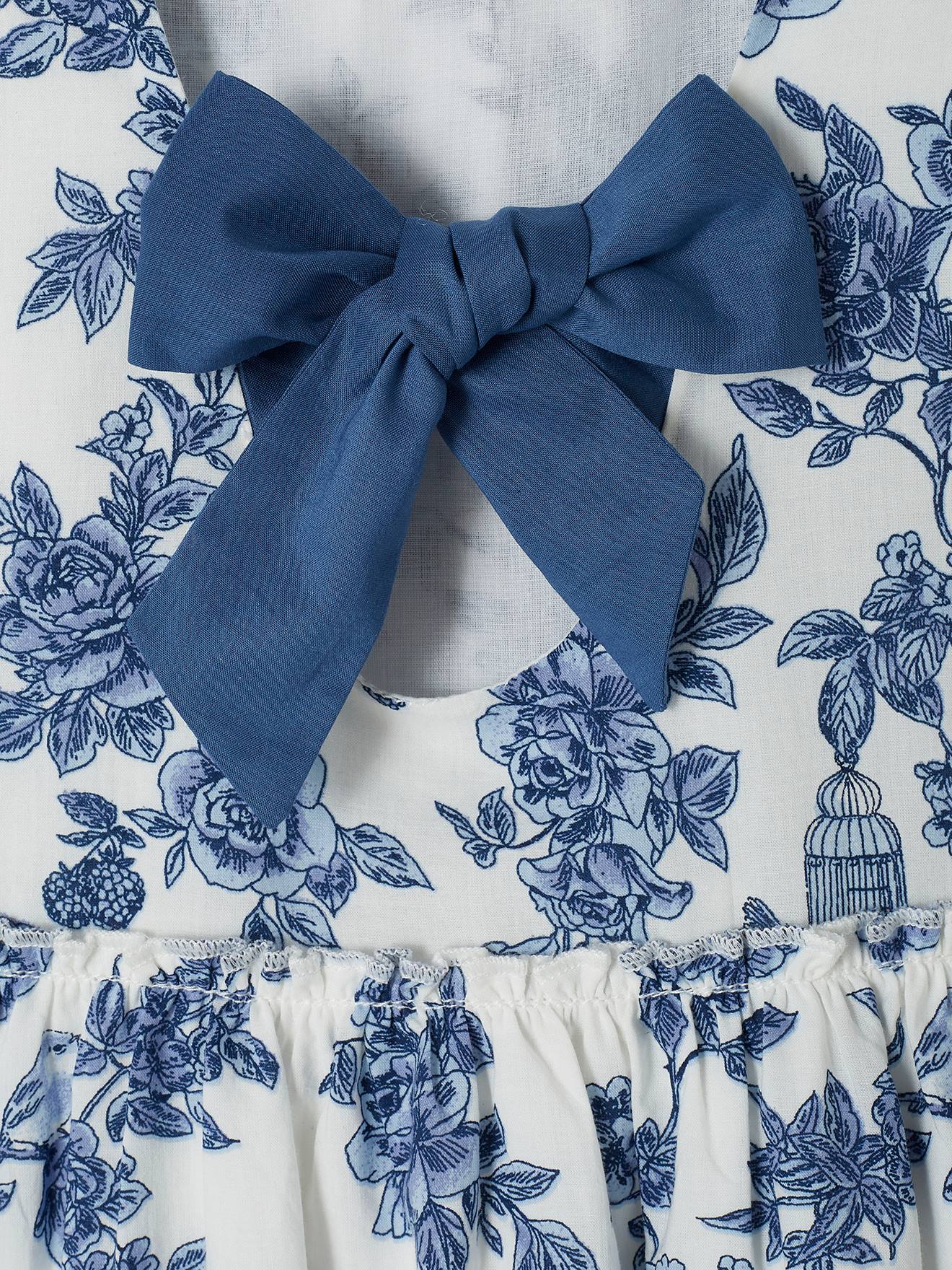 Vestido de festa infantil com flores e laço nas costas, na cor branco-creme.