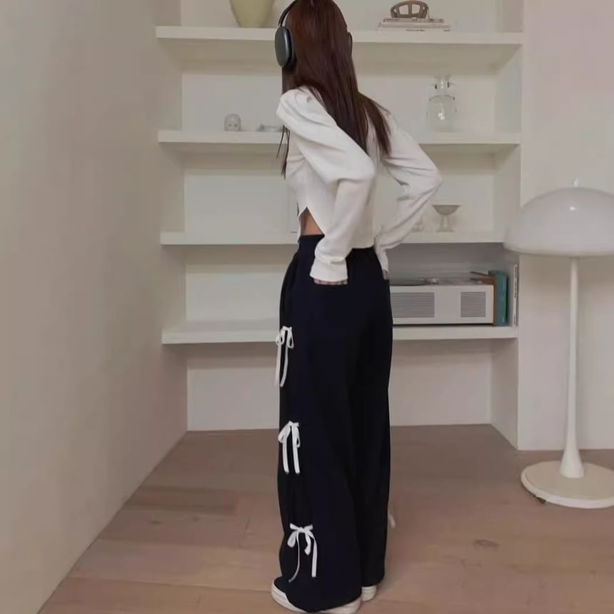Rosesand - Wijde joggingbroek met hoge taille en strikaccent