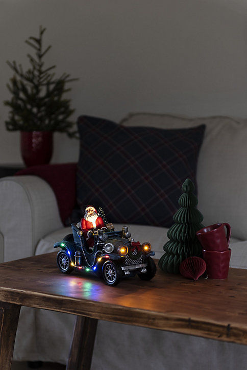 Figurine Père Noël en voiture 11 LED 16 cm