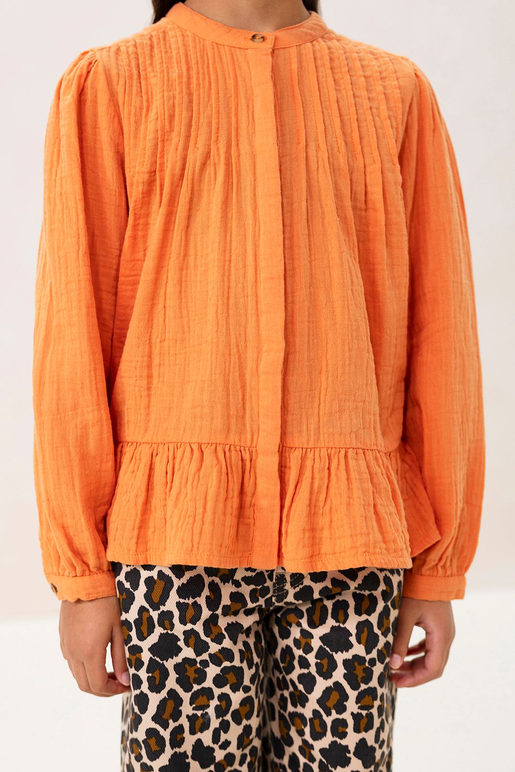 Oranje blouse met pintuck details