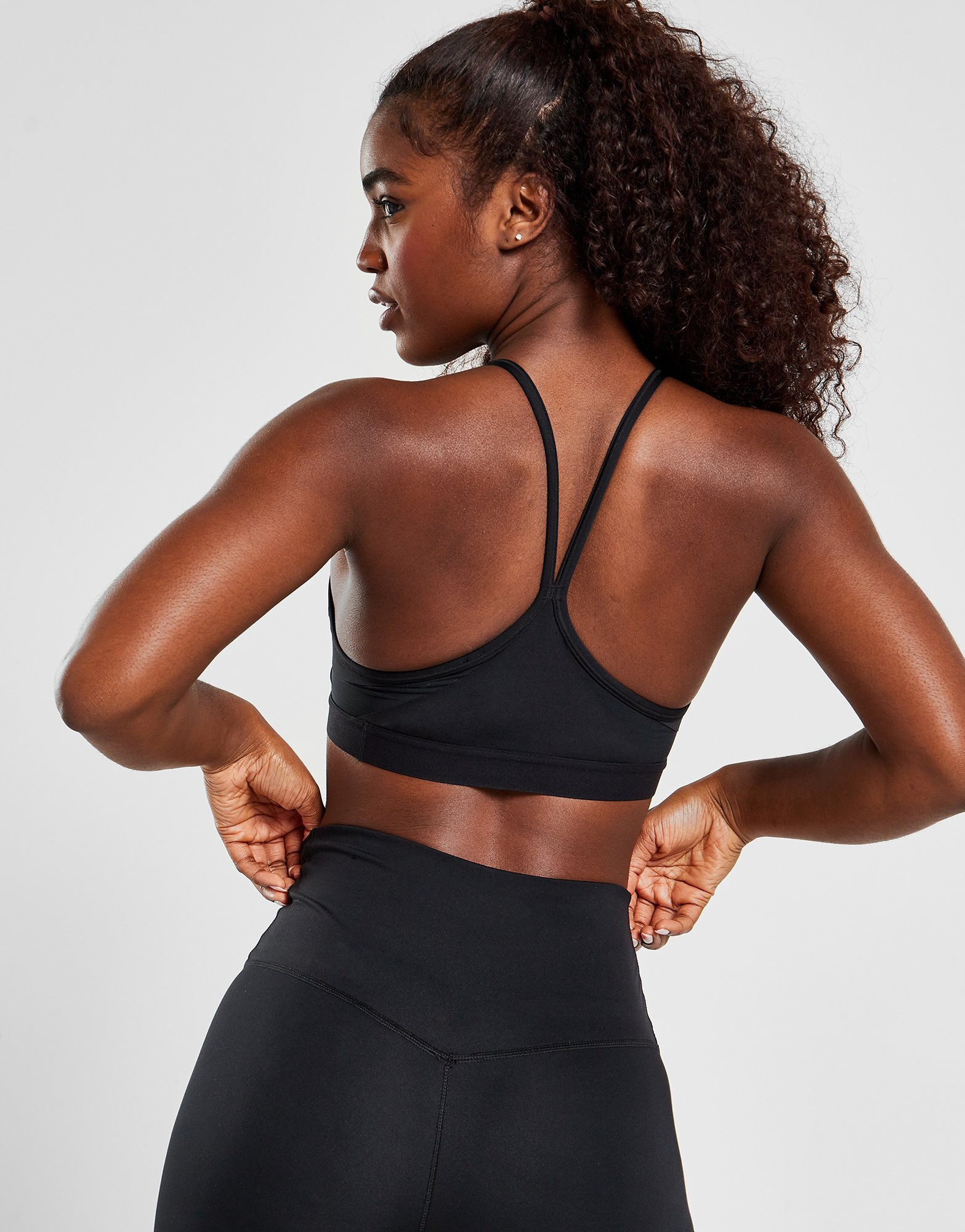 Nike Brassière de sport rembourrée à maintien léger et col en V Nike Indy pour femme