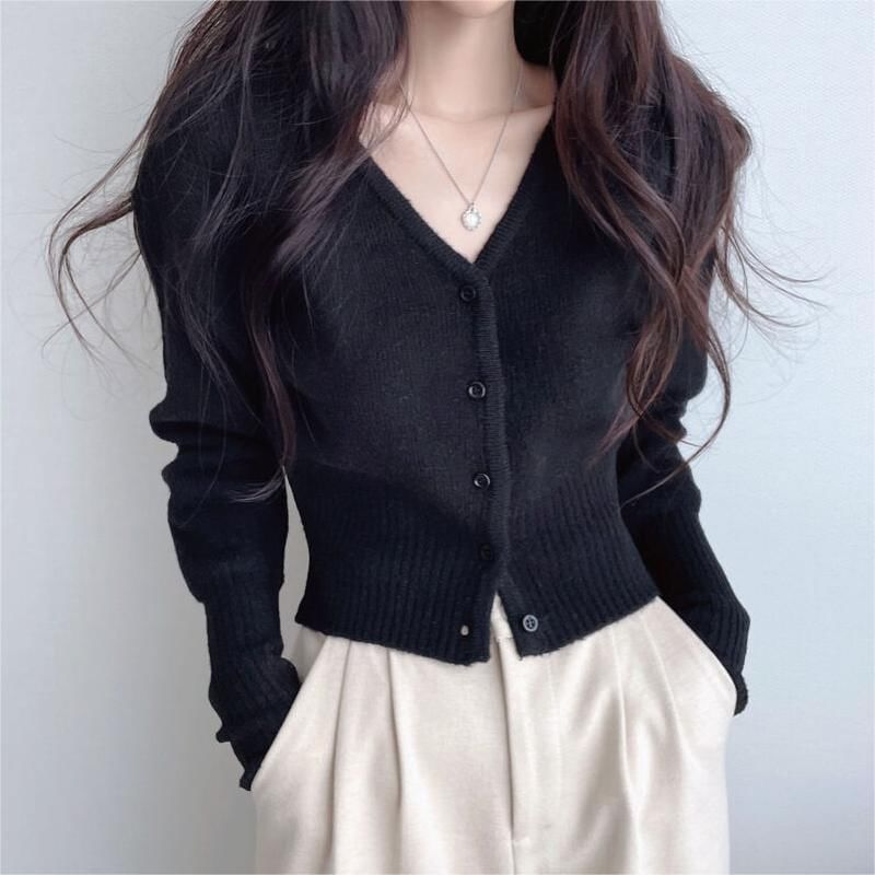 Coris - V-hals, knoopjes, effen cropped vest