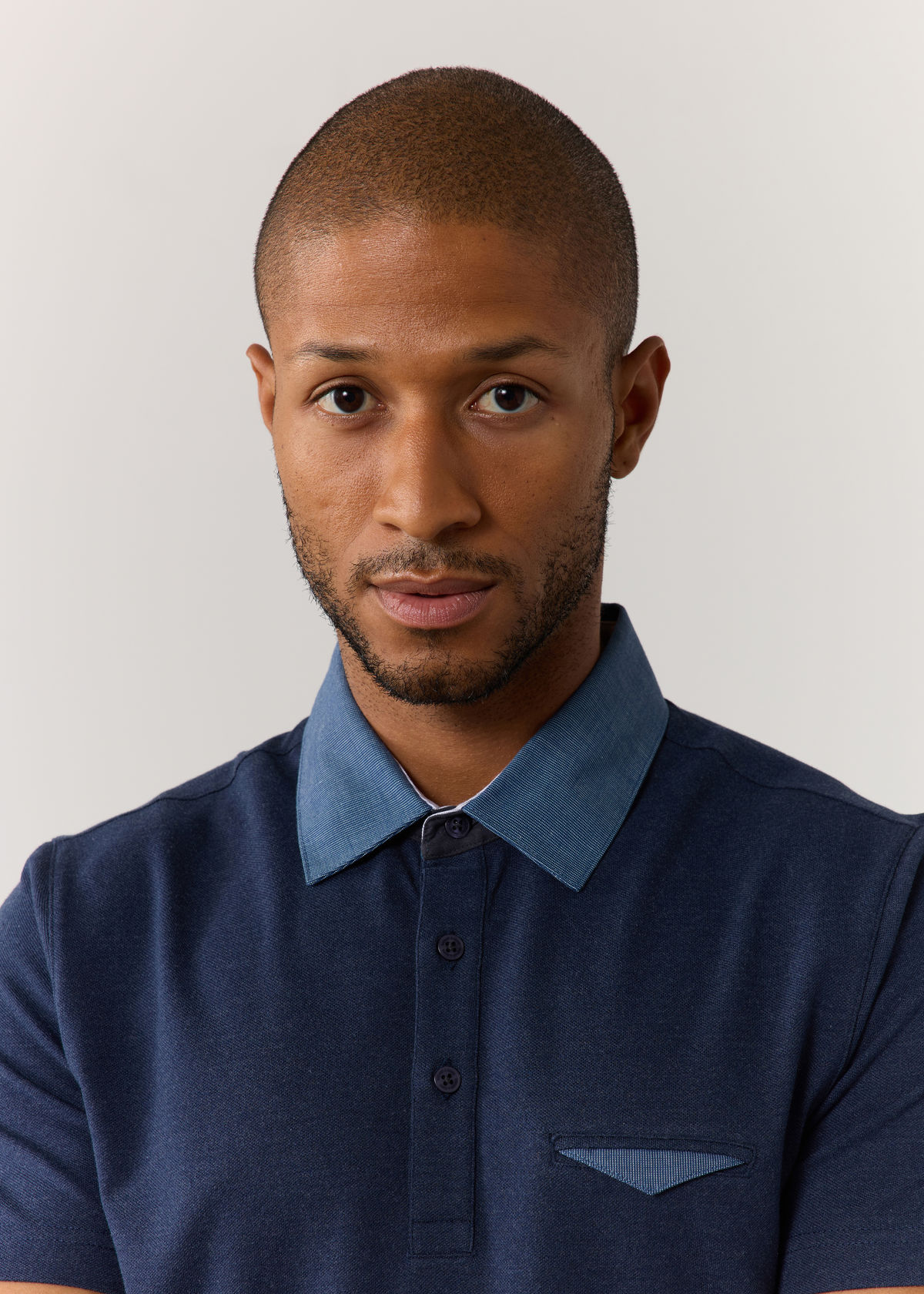 Polo manches courtes Slim en coton mélangé uni bleu jeans