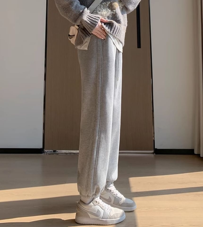 evanesce - Effen joggingbroek met hoge taille, wijde pijpen en chenillevoering