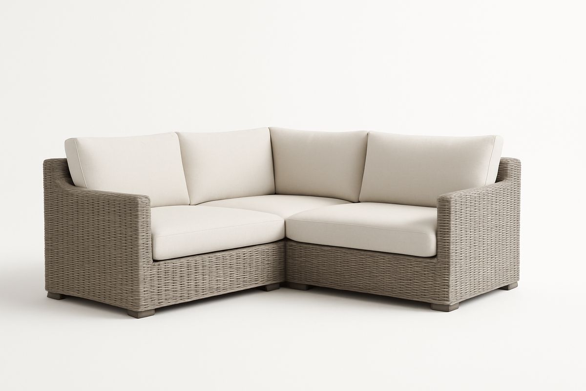 Ecksofa aus Polyrattan mit Cremefarbenen Kissen