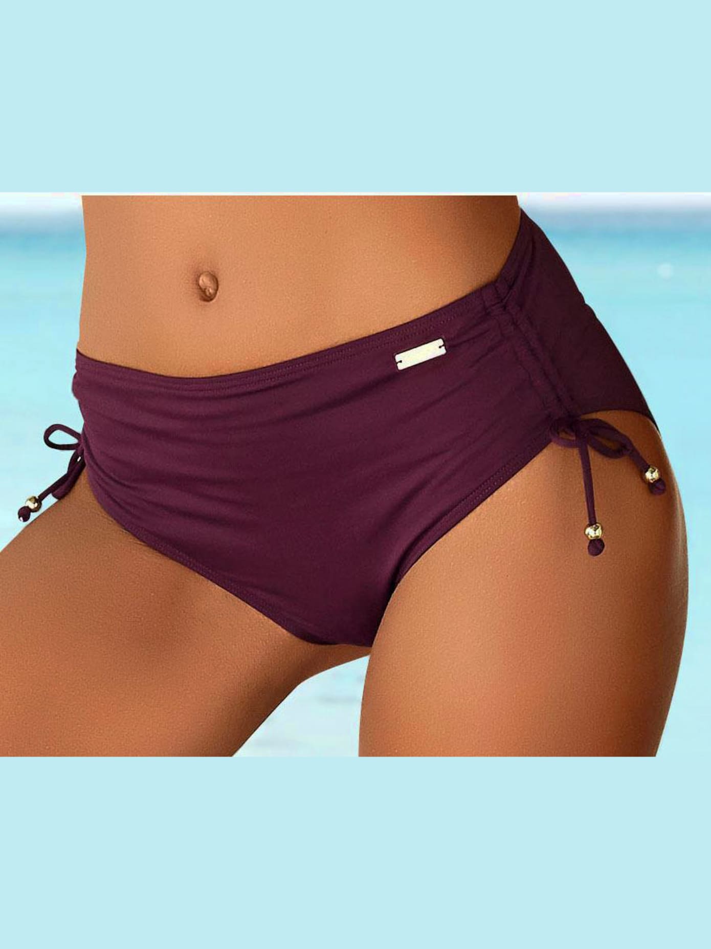 Bas de maillot de bain coupe haute, à resserrer sur les côtés