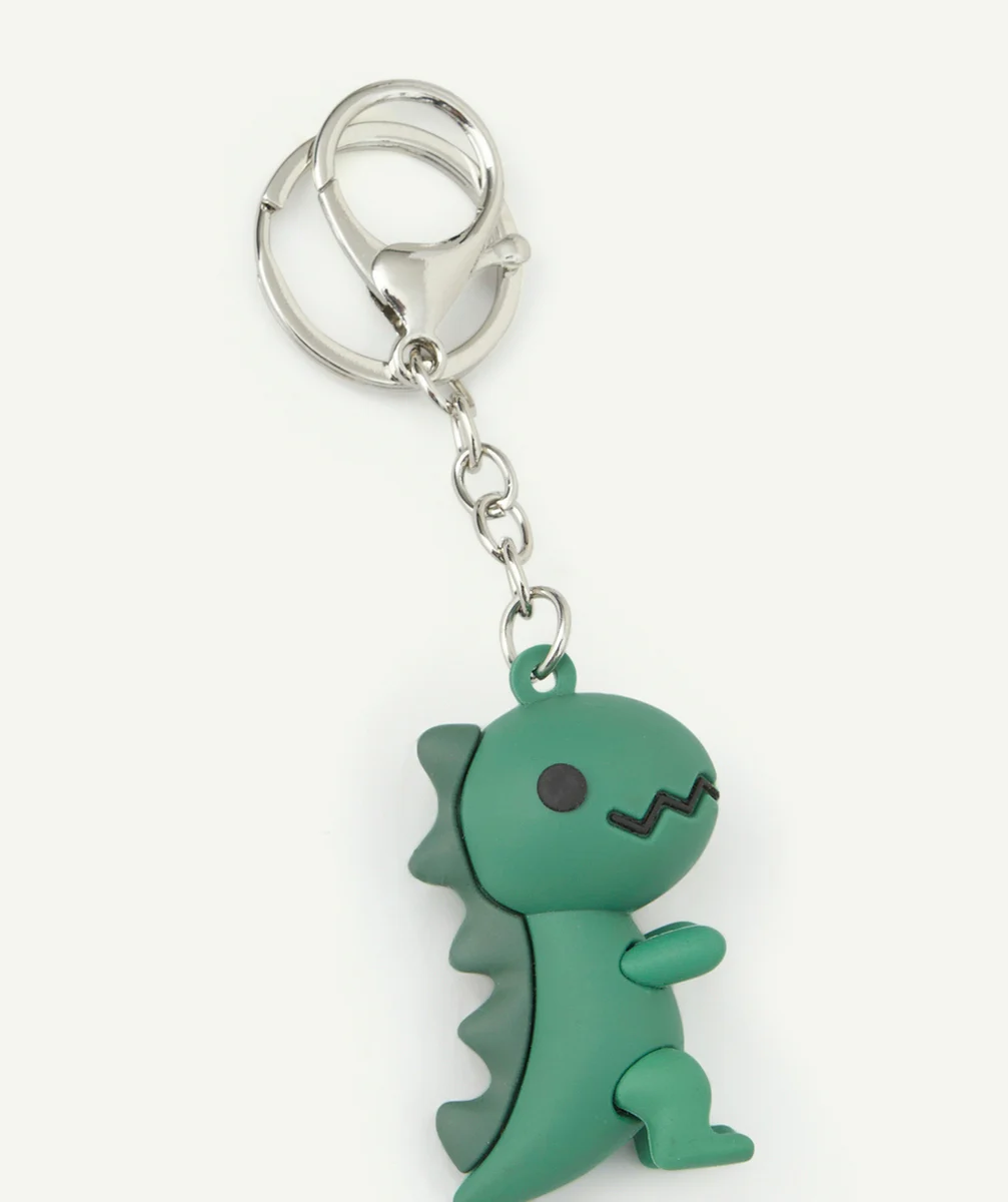 PORTE-CLÉS GARÇON COULEUR ARGENTÉE AVEC DINOSAURE VERT