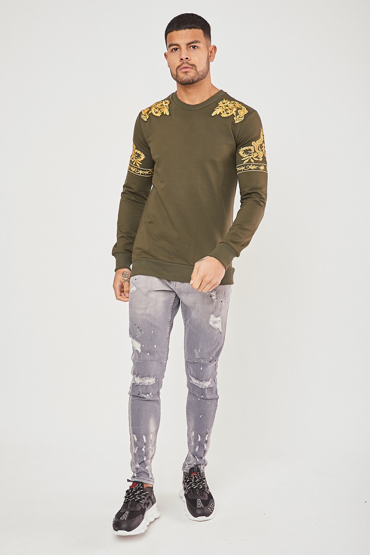 Pull kaki à fleurs dorées