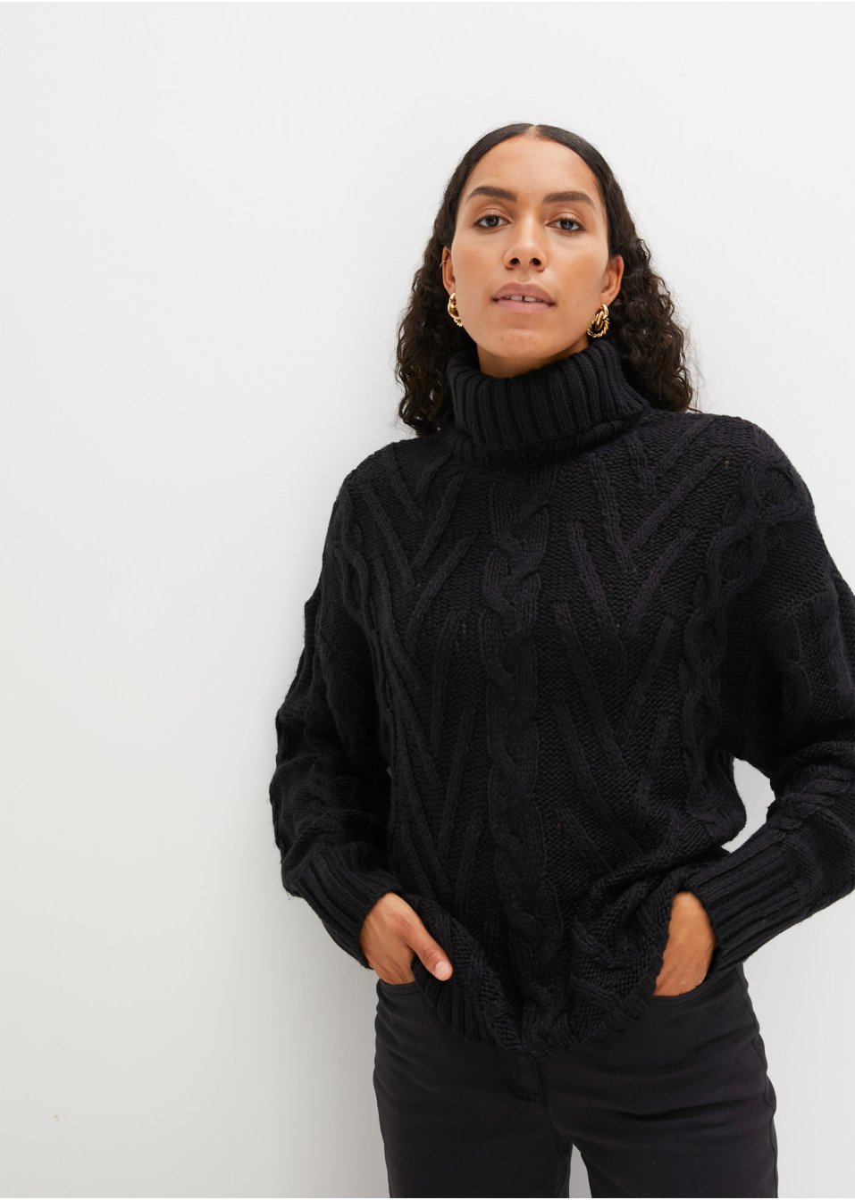 Pull à col roulé et torsades