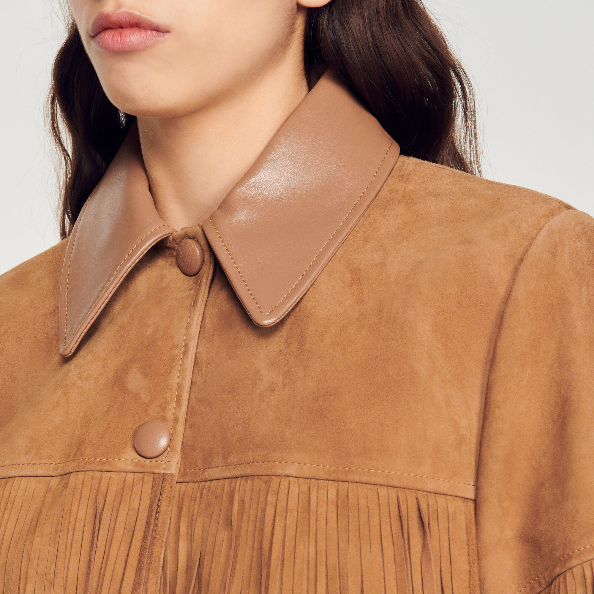 Veste longue en cuir á franges
