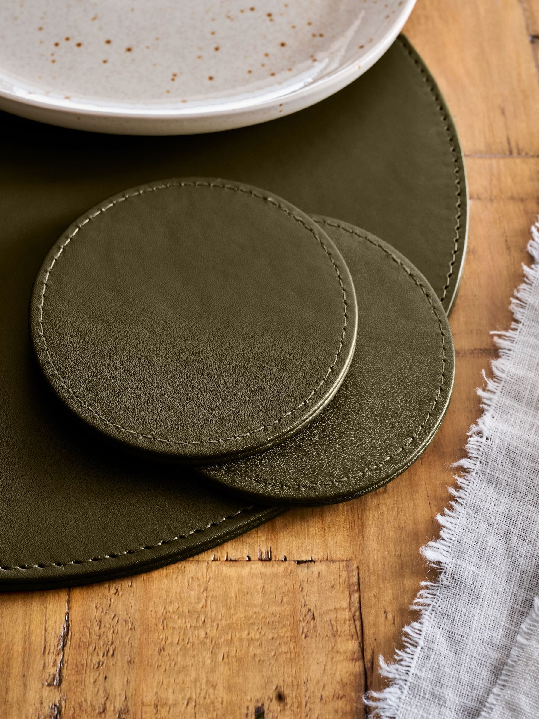 Set van 4 omkeerbare placemats en onderzetters van imitatieleer