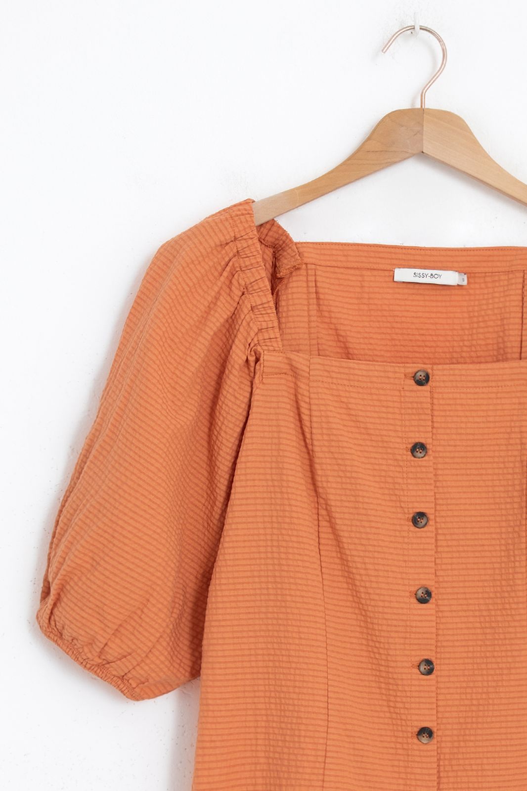 Oranje blouse met pofmouwen