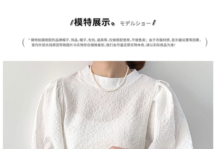 Meatacci - Blouse met hoge hals en pofmouwen en strepen