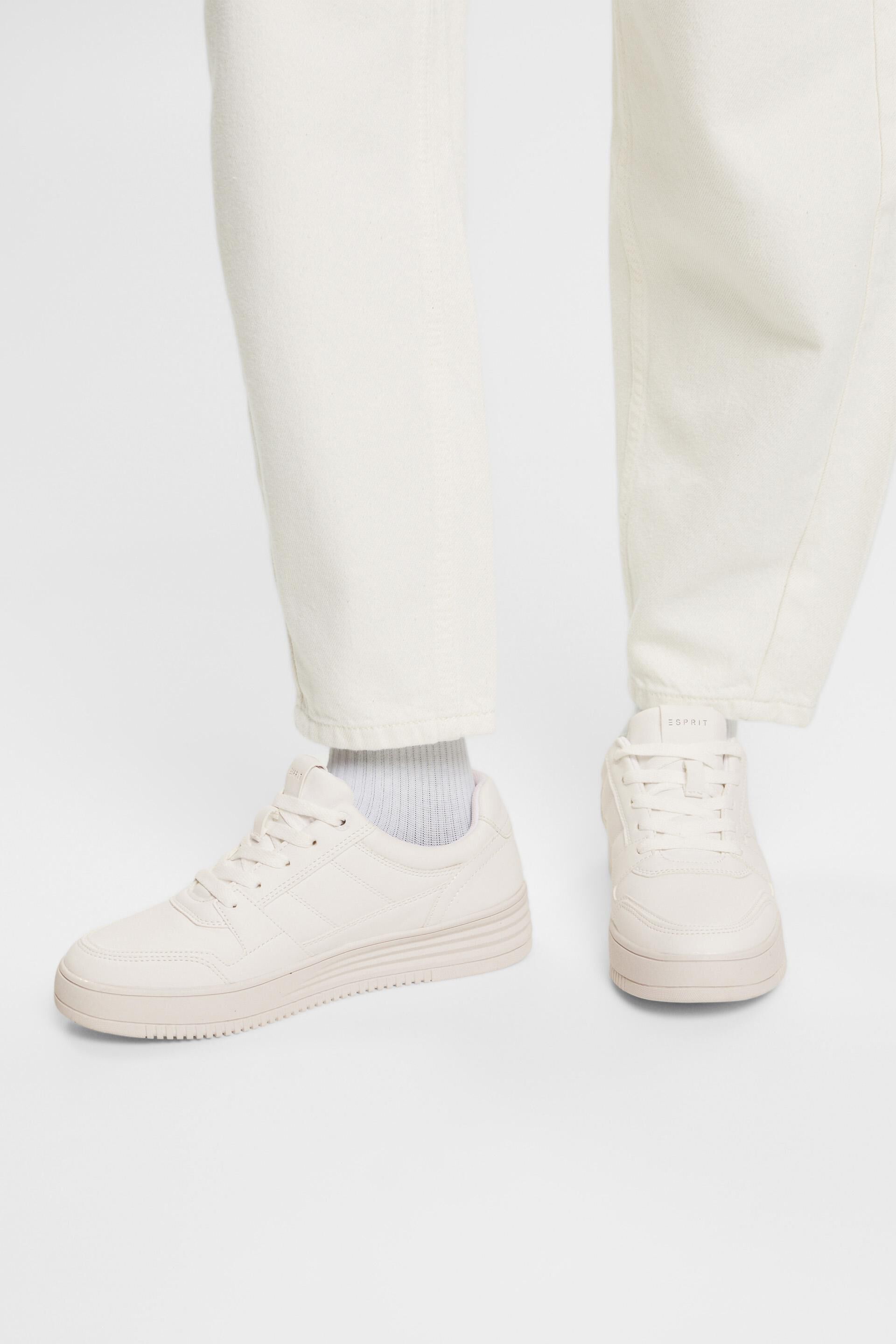 Sneakers en similicuir dotées d’une semelle à plateau
