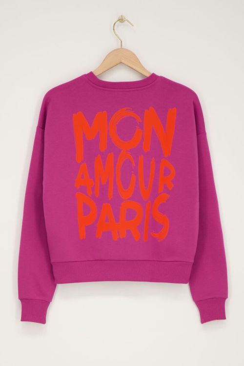 Paarse sweater met oranje 