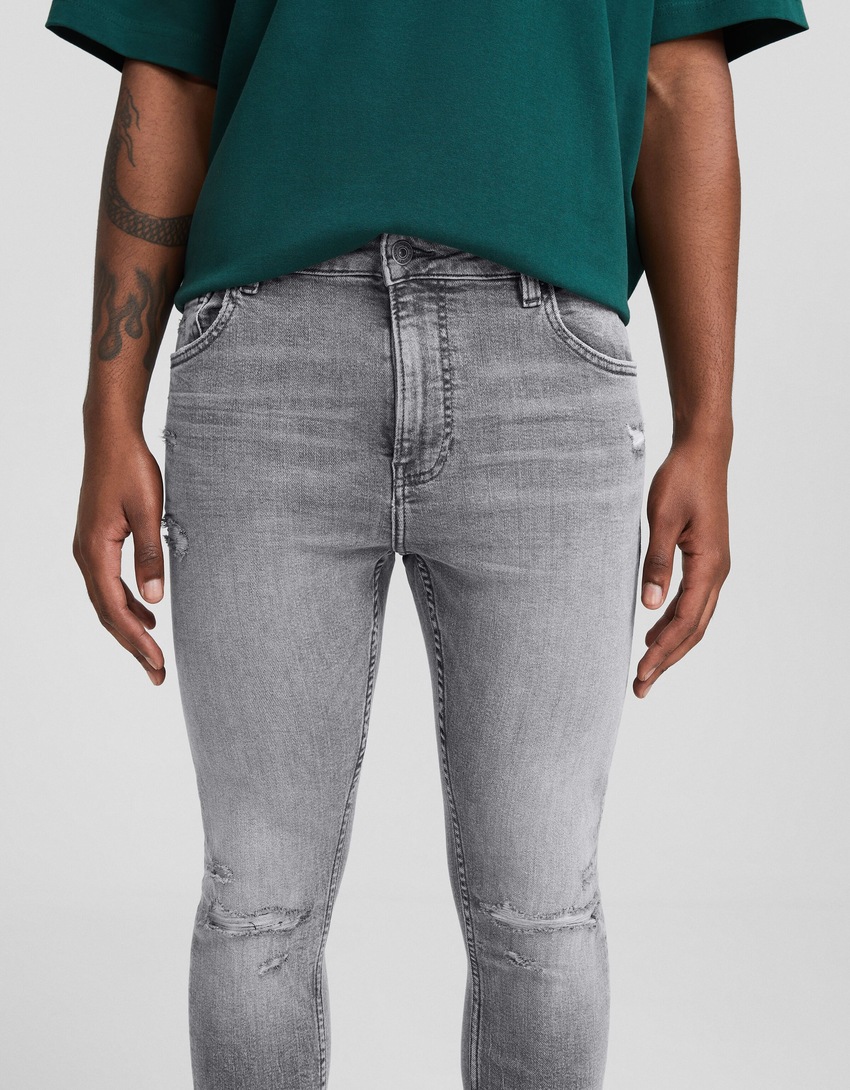 Calça jeans skinny rasgada