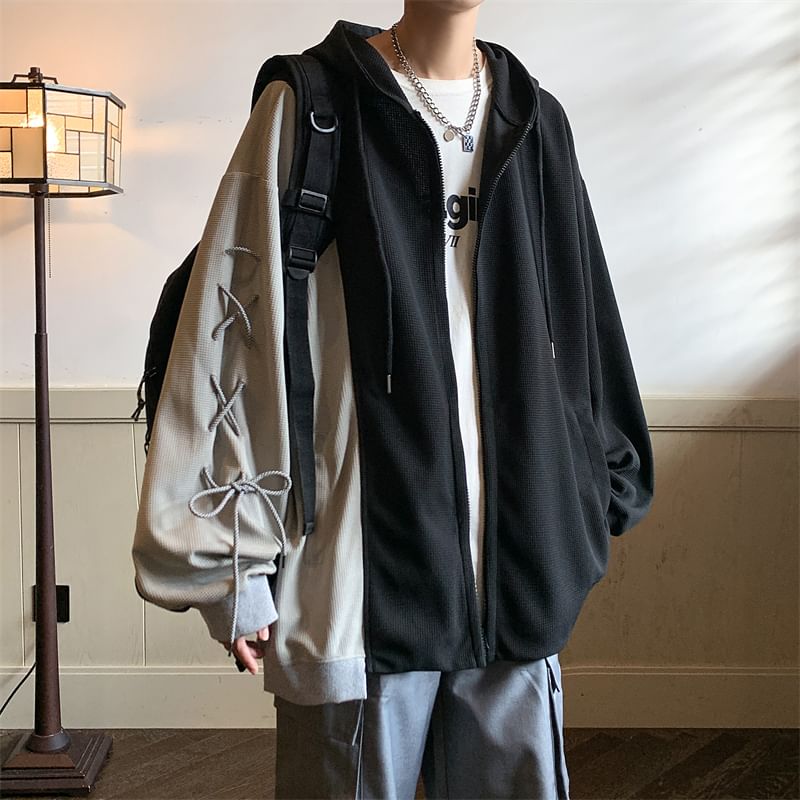 Derbundy - Tweekleurige oversized hoodie met vetersluiting en rits