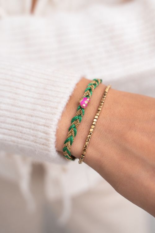 Groene gevlochten armband met bedel