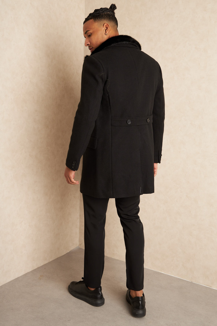 Veste noire mi-longue à fourrure