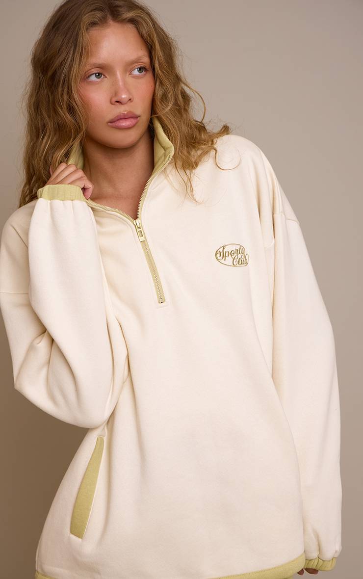 Crème Sweat-shirt Crème À Col Zippé Un Quart Avec Broderie Sporty Club