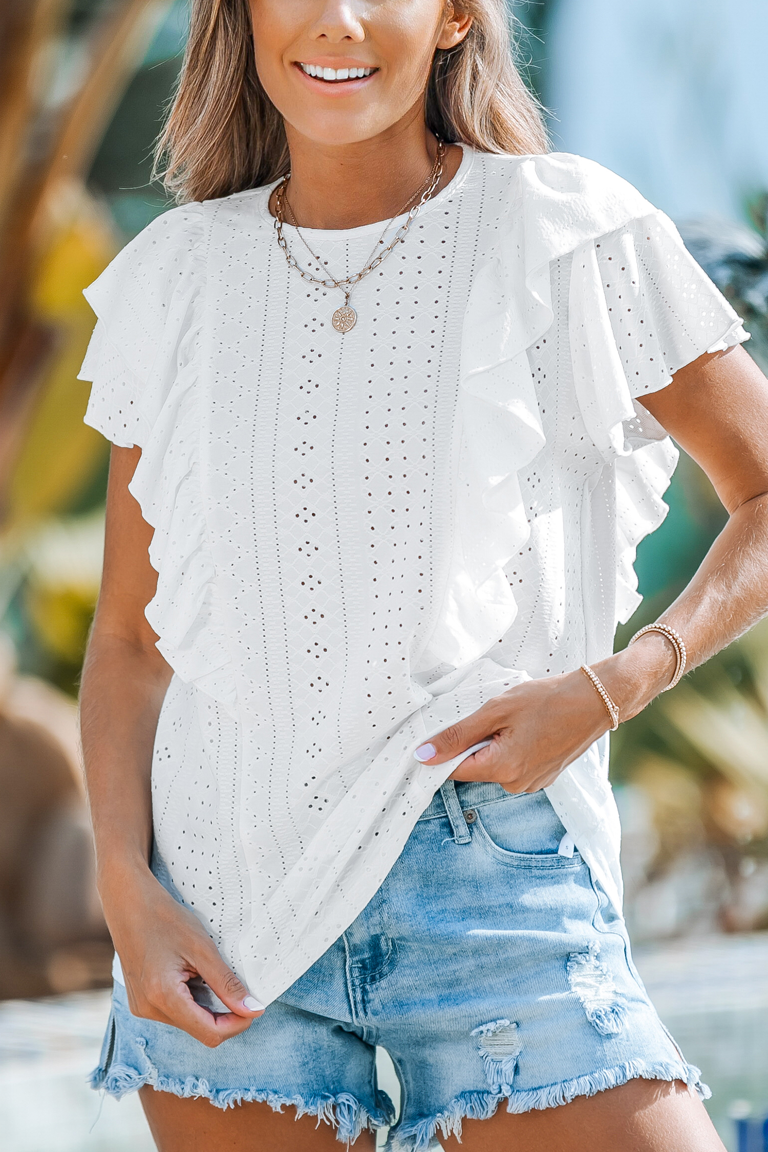 Blouse à volants superposés en œillets
