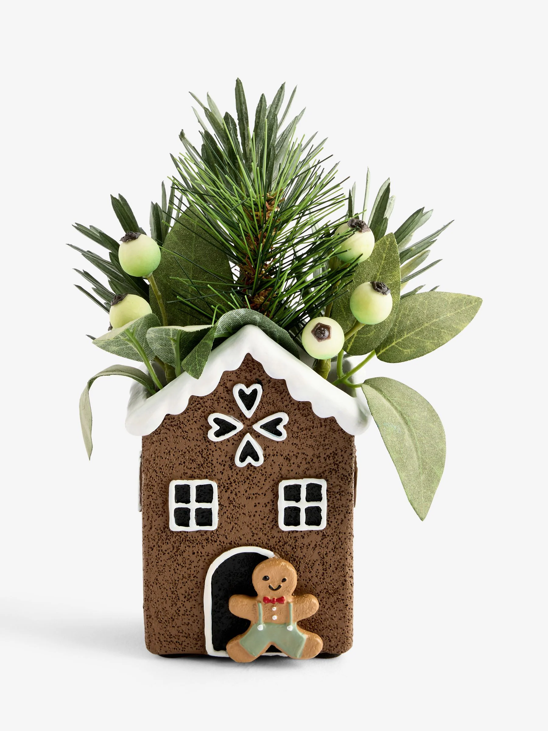 Kunstmatige winterse bladeren in een peperkoekenhuisje