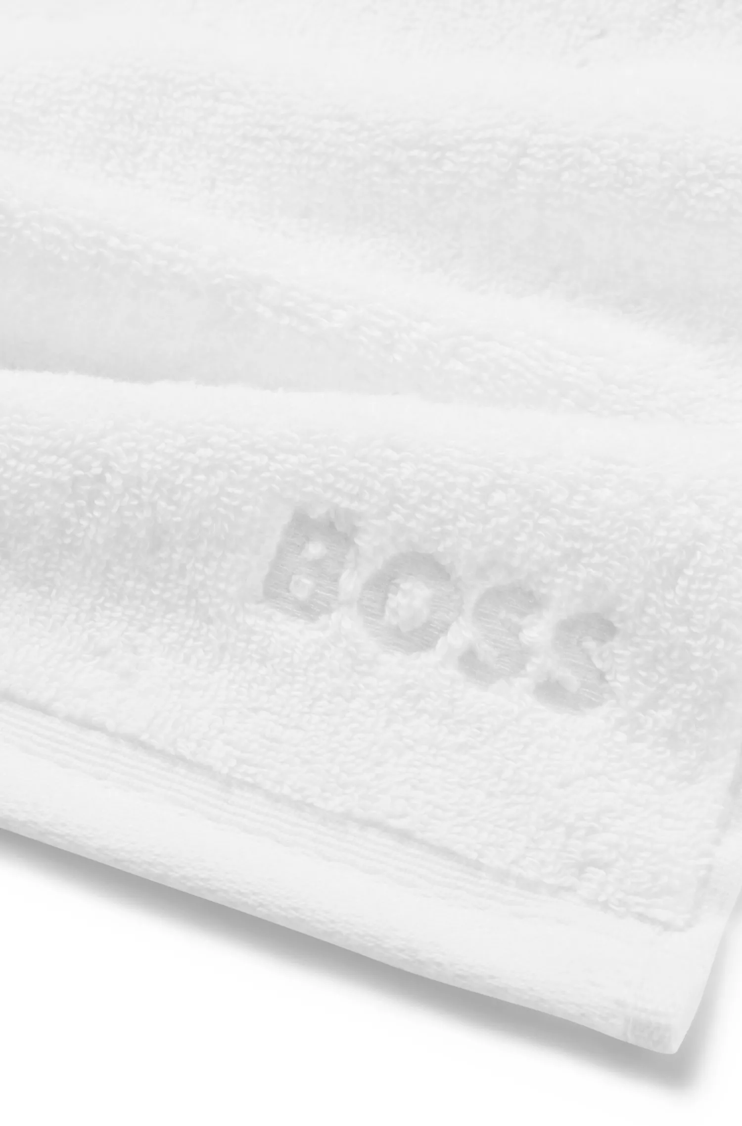 Toalha de rosto BOSS com logotipo preto bordado em algodão do Egeu.