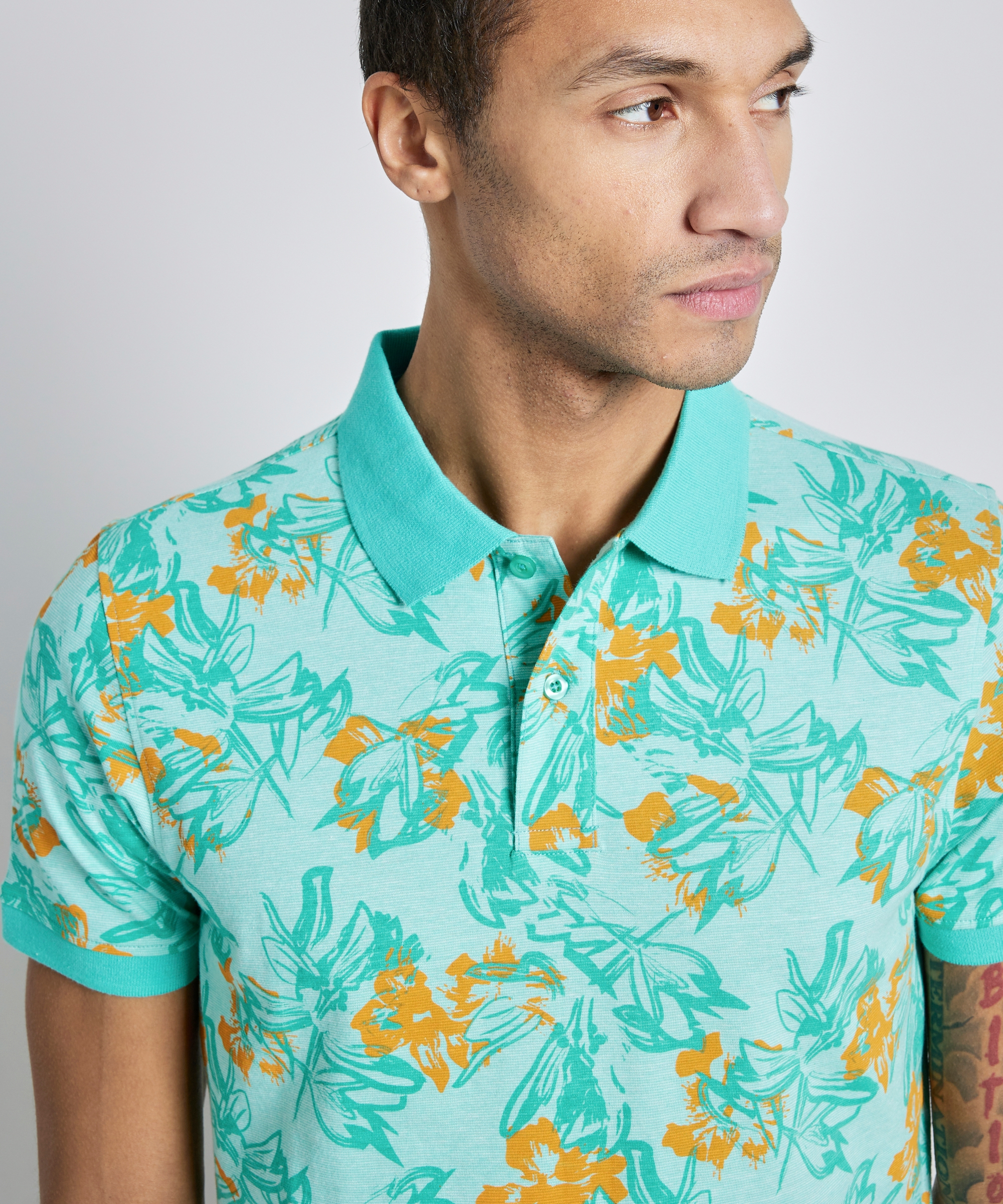 polo met tropische print